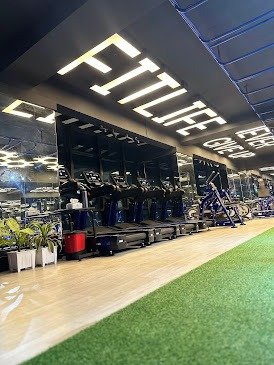 Row of treadmills under the Fitlife branded wall